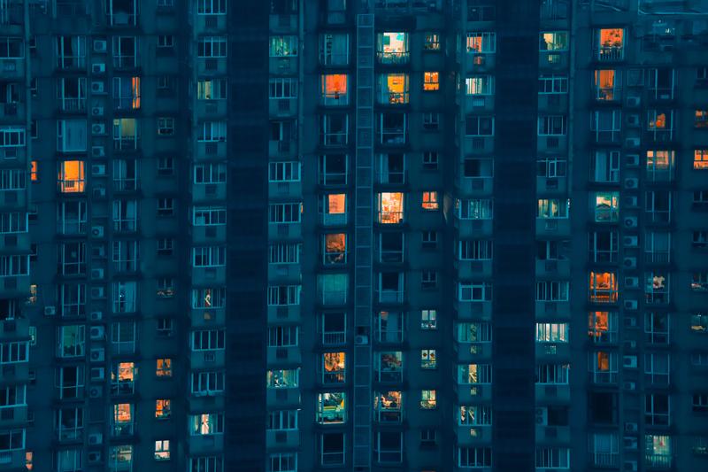 a high-rise apartment building in China at night